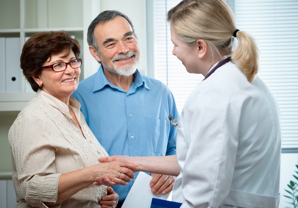 Senior couple visiting a doctor.
