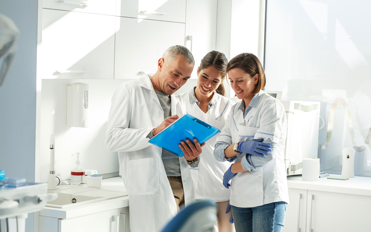 Orthodontist sharing strategies to grow his practice with his team.